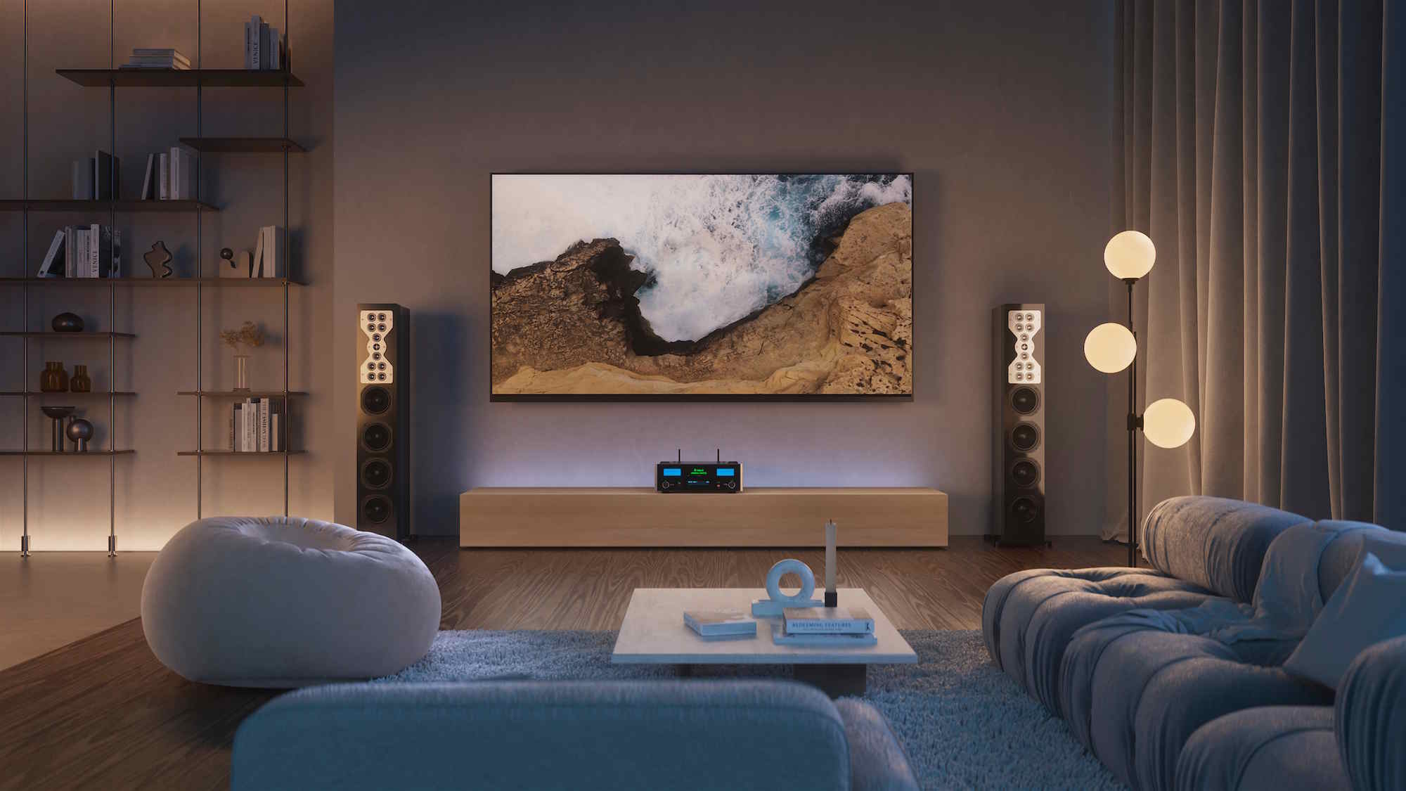 Modern living room with a wall‑mounted TV, tall speakers, and warm ambient lighting.